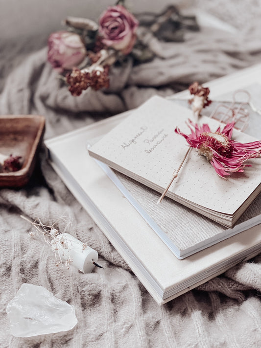 books on blanket with flowers